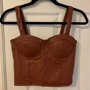 Faux leather top. New with tags